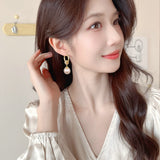 2025 Retro Hong Kong style niche design sense pearl temperament ear buckle female fashion celebrity exquisite zircon long versatile earrings