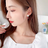 2025 Autumn and winter New Year's earrings niche design earrings temperament exquisite women's s925 silver needle love zircon pearl stud earrings