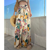 2025 Dopamine graffiti print wide-leg pants women's summer seaside wear high-waisted beach culottes drape split-ended color pants