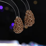 2025 Autumn and winter high-end inlaid pearl earrings s925 silver needle light luxury celebrity simple retro pomegranate red fashion stud earrings